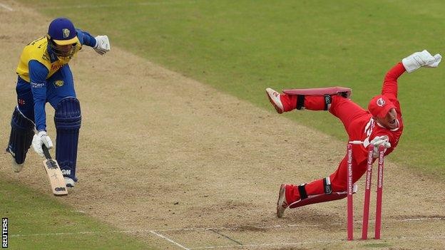 Cricket - T20 Blast - Durham v Lancashire - Emirates Riverside, Chester-le-Street, Britain - August 27, 2020 Durham's Graham Clarke run out by wicket keeper Lancashire's Alex Davies Action Images via Reuters/Lee Smith TPX IMAGES OF THE DAY